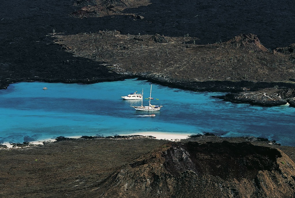 Boats on the West coast of the island of San El Salvador, Archipelago of Galapag.jpg