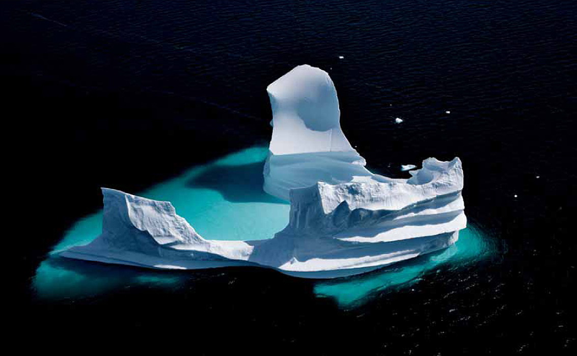 Eroded iceberg in Unartoq Fjord, Greenland.jpg