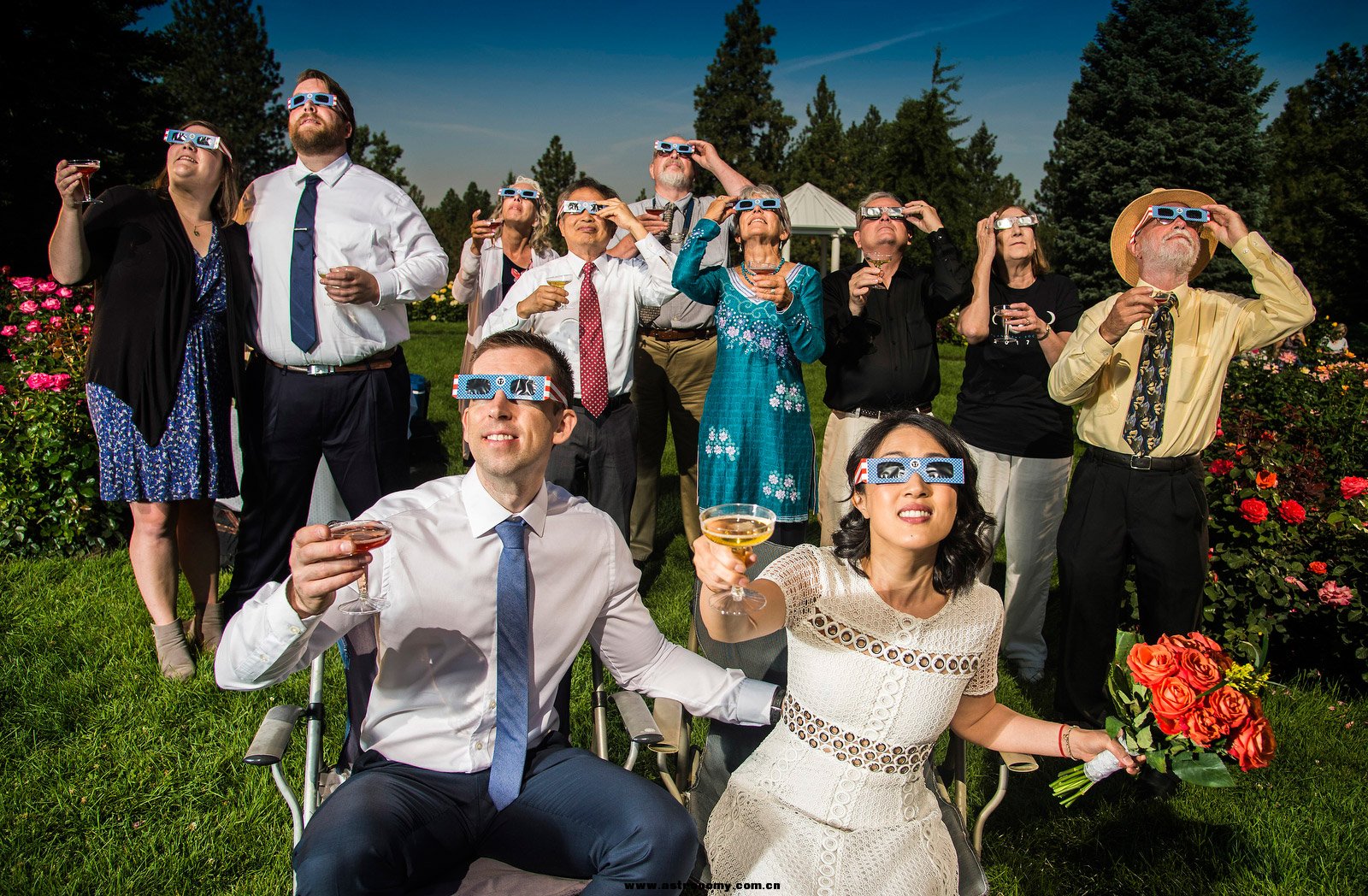 After their wedding ceremony, Nathan Mauger and Connie Young toast to the eclips.jpg